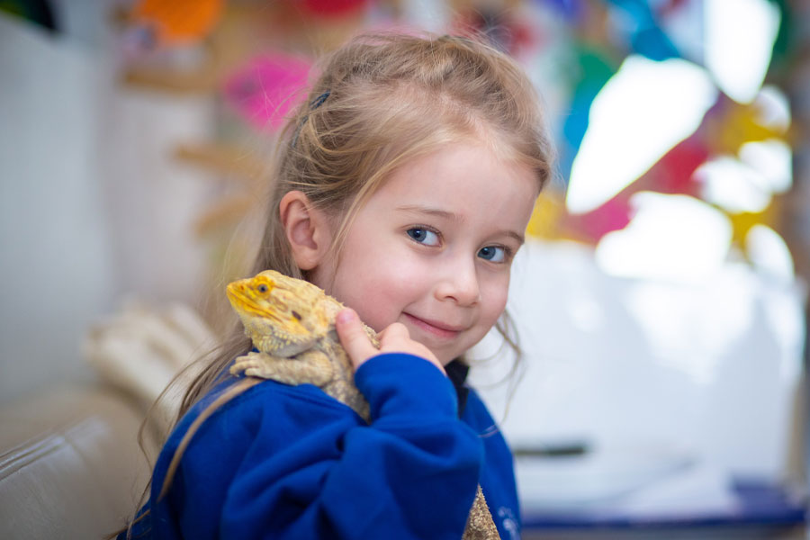Nursery student with lizard